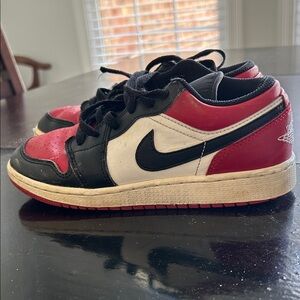 Nike  Air Jordan 1 Low Bred Toe Black and Red Low-Top Sneakers